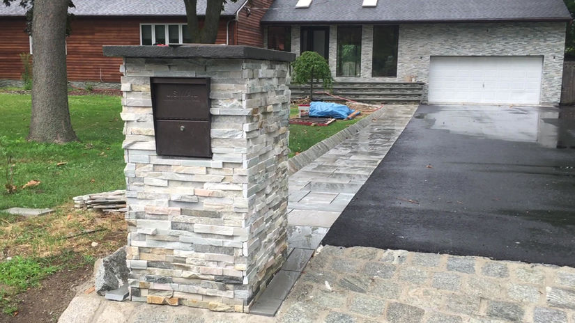 complete renovation of front yard , natural stone